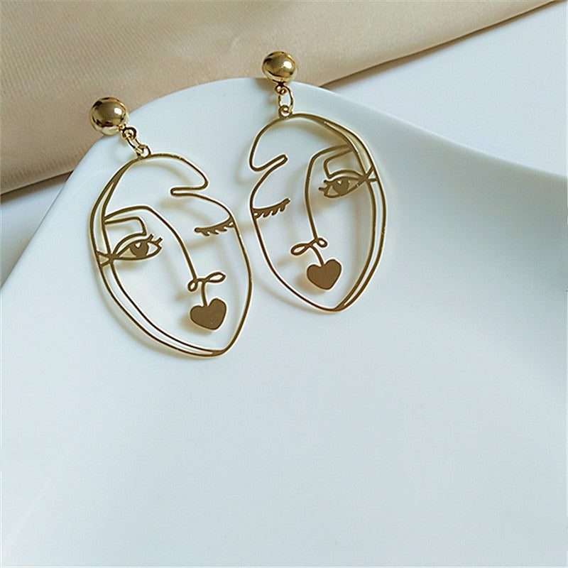 Pre Order:  Wink Face Hollow Earrings